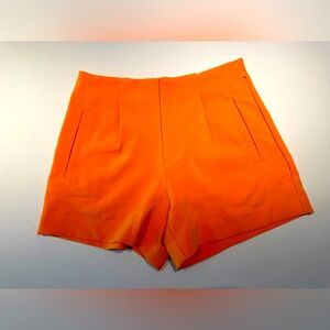 Orange high-waisted shorts